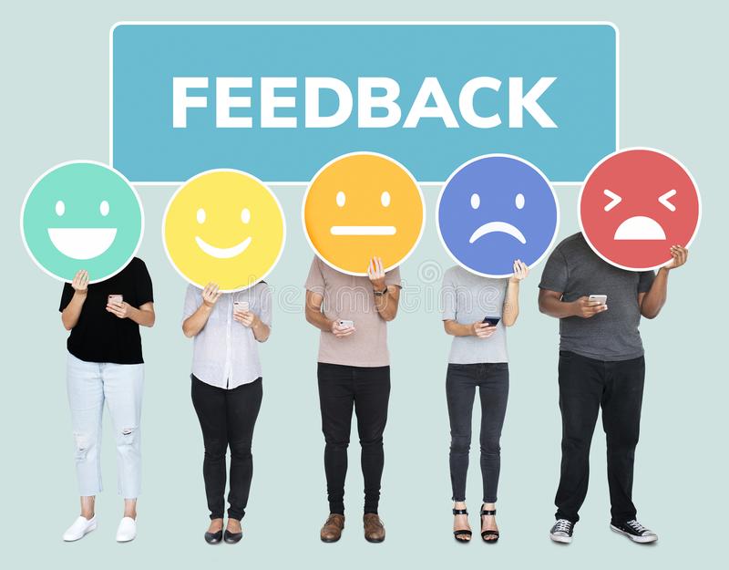 people-showing-customer-feedback-evaluation-emoticons-130140715